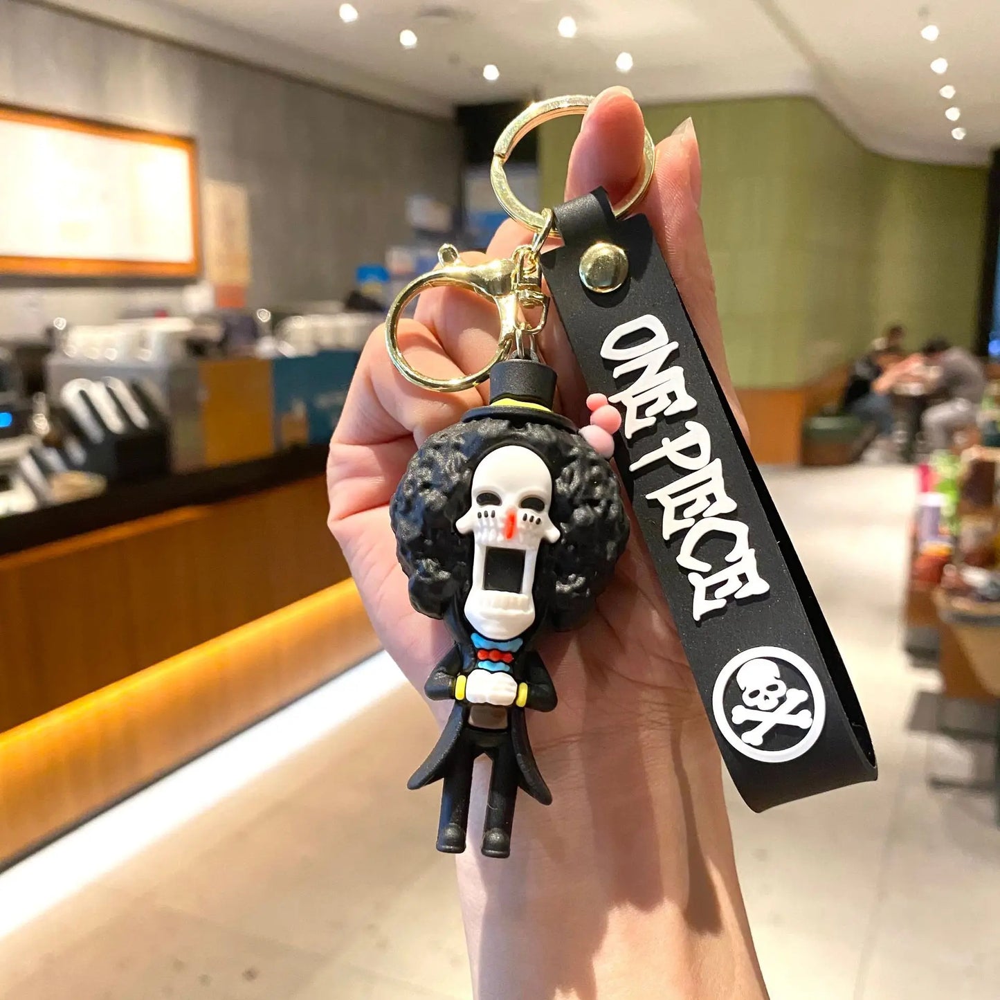 Portachiavi dei cartoni animati di One Piece – Brook su sfondo nero